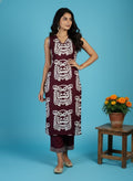 Sleeveless Long Cord Set with Tribal Face Print Design, Deep Maroon Color, V-Neckline, Paired with Matching Flared Pants – Casual and Ethnic Fusion Wear